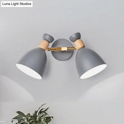 Modern sage green and gray double shade wall sconce with wooden accents and brass hardware measures inches high
