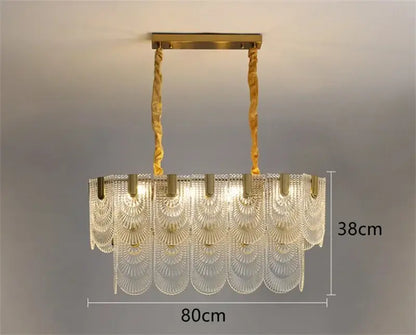 Modern scalloped art glass chandelier with clear fan-shaped glass panels and gold-toned metal decorbites art glass light