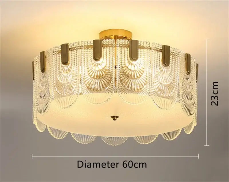 Modern scalloped art glass chandelier with gold-toned metal base and clear glass panels for elegant dining room decorbites art glass