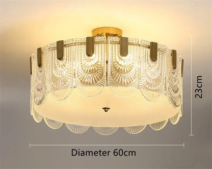 Modern scalloped art glass chandelier with gold-toned metal base and clear glass panels for elegant dining room decorbites art glass