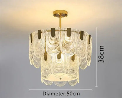 Modern scalloped art glass chandelier with cascading clear glass fan-shaped shades and gold-toned metal accents by decorbites