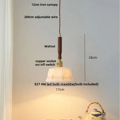 Modern scalloped off-white ceramic led pendant light with hand-painted floral pattern and warm decorbites ceramic led glow