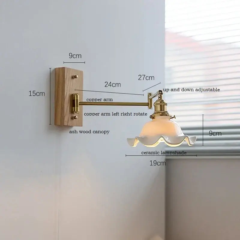 Modern scalloped glass and brass wall light with a warm brass-finished copper arm and decorbites ceramic LED shade