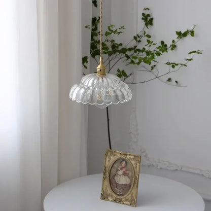 Modern scalloped glass flower led pendant light with clear fluted glass and gold-toned hardware for dining room use