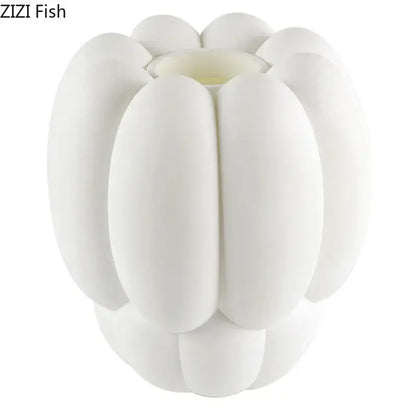 White ceramic creative petal vase with segmented pumpkin-like design for modern living room decor