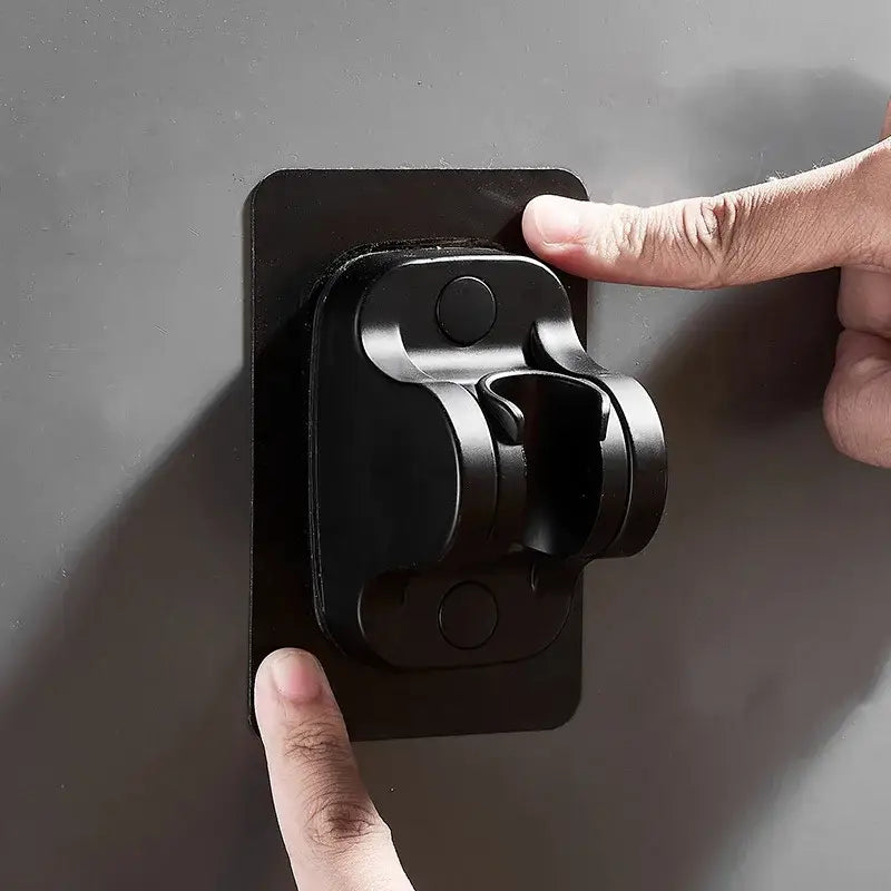 Black magnetic shower holder bracket with adjustable arm and circular knobs for modern bathroom use