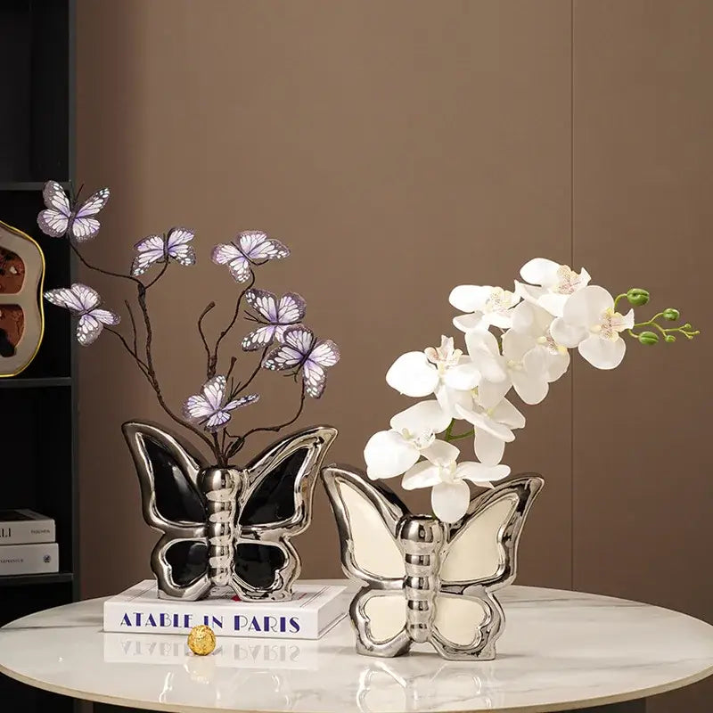 Two modern silver black and white butterfly ceramic vases with ceramic butterfly accents for living room decor