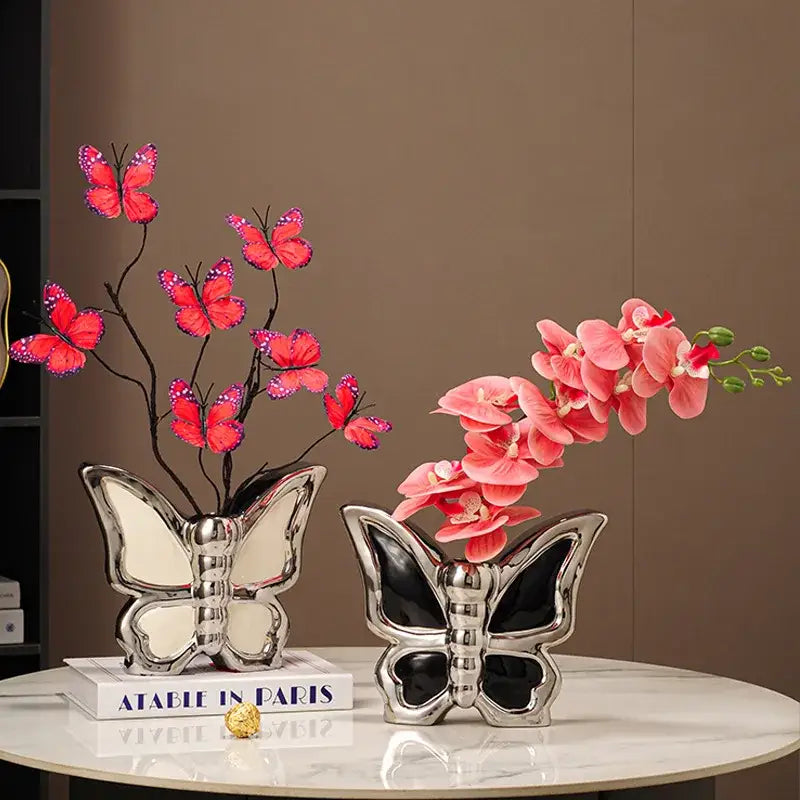 Two silver black and white butterfly ceramic vases featuring red butterflies and pink orchids for living room decor