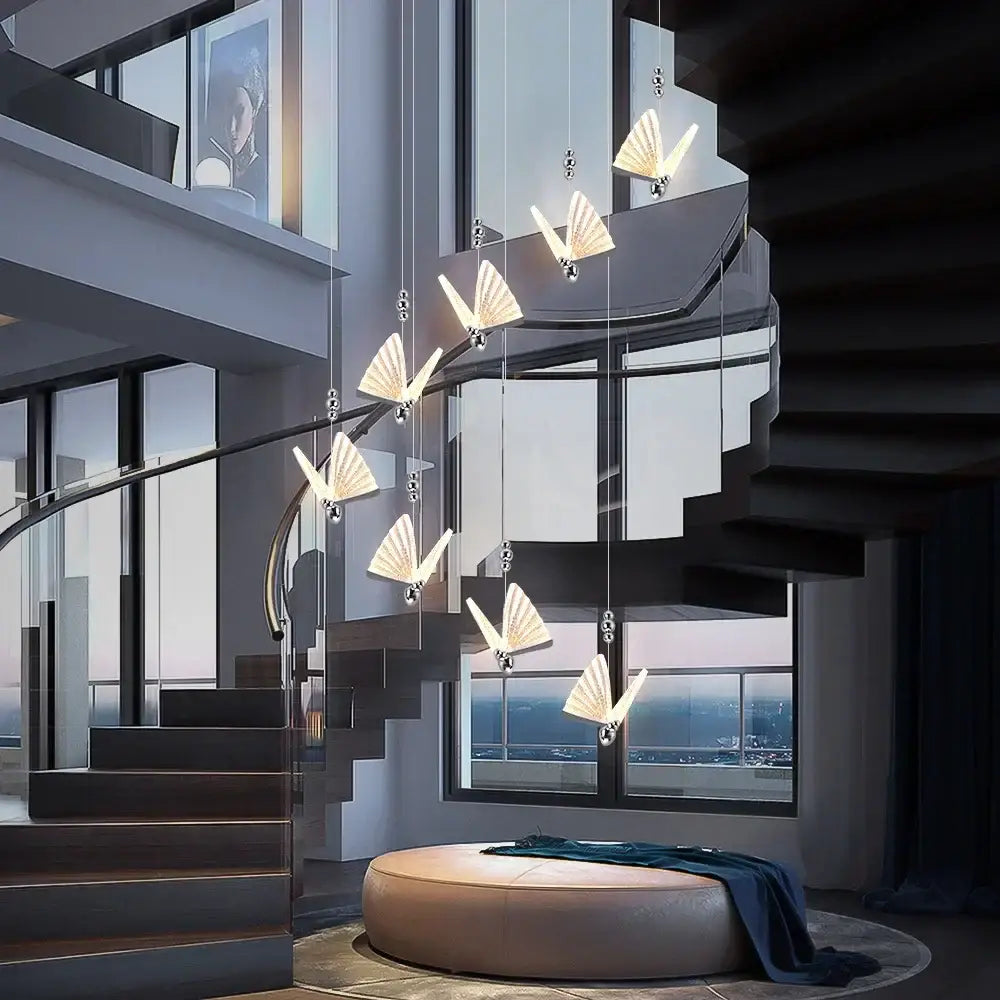A modern silver decorbites butterfly led chandelier pendant light with illuminated fan-shaped fixtures for dining room decor