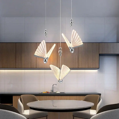Three elegant translucent white butterfly led chandelier pendant lights with silver accents for modern dining room decorbites pendant light
