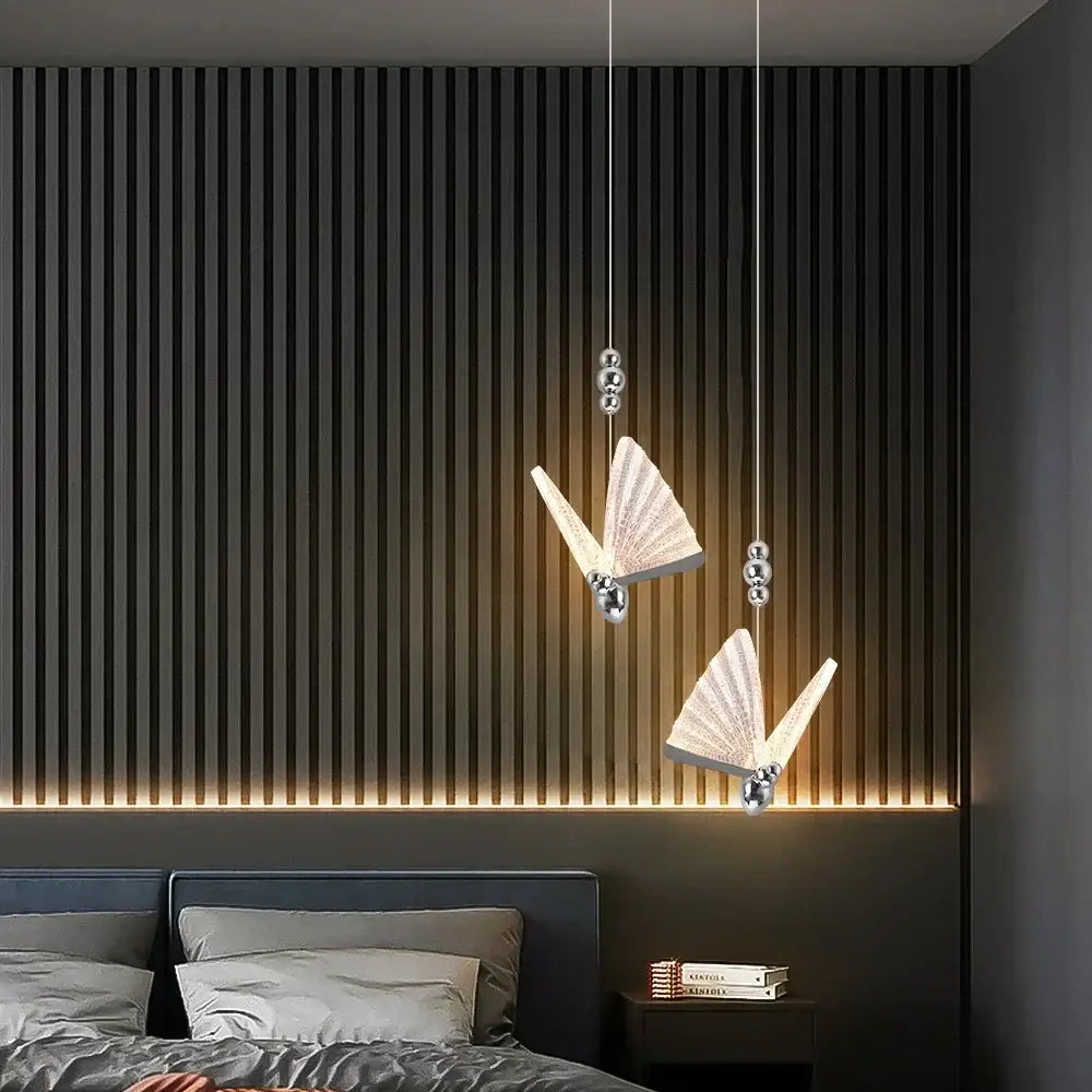 Two elegant silver decorbites butterfly led pendant lights with translucent wings for modern dining room decor