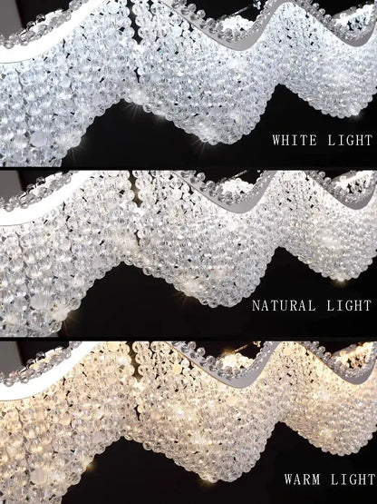 Modern silver crystal bead chandelier with wavy metal frame and cascading clear glass beads decorbites crystal bead led light