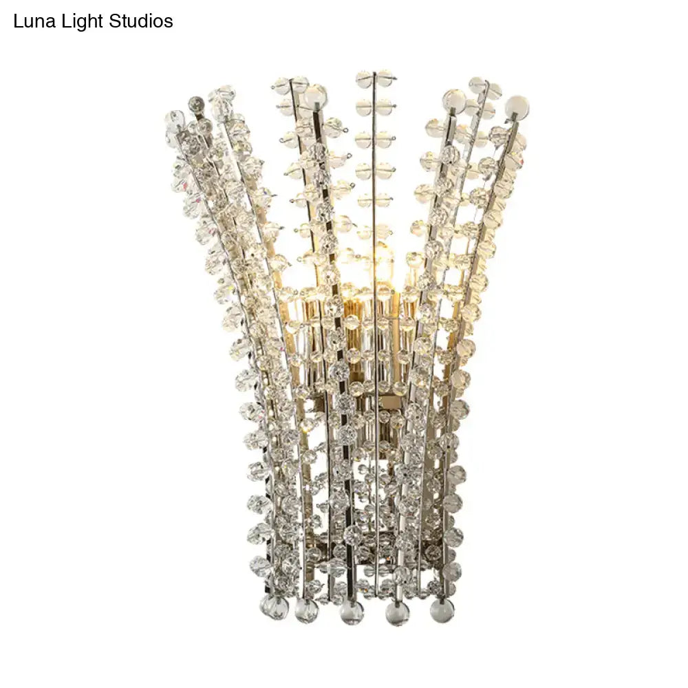 Modern silver crystal bead wall lamp with a sparkling cascading design of clear glass beads and metallic rods