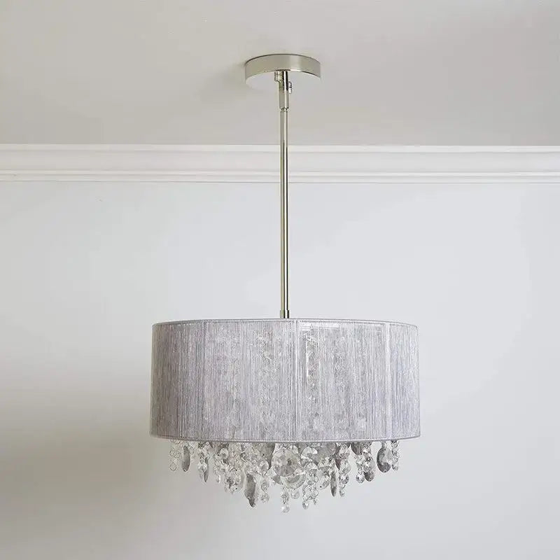 Modern silver crystal fabric pendant lamp with textured drum shade and dangling crystal droplets for bedroom decorbites crystal fabric