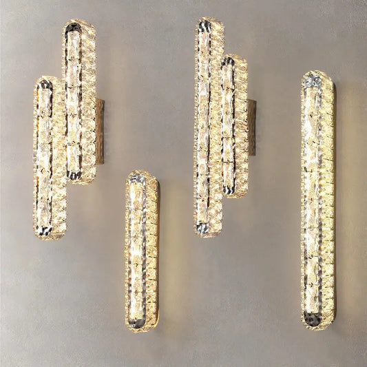 Modern silver crystal led wall lamp with elongated design and warm golden glow for bedroom decorbites crystal led lighting