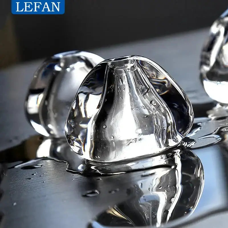 Modern silver crystal pendant light with clear glass ice cube bubbles for elegant dining room cord pendant installation