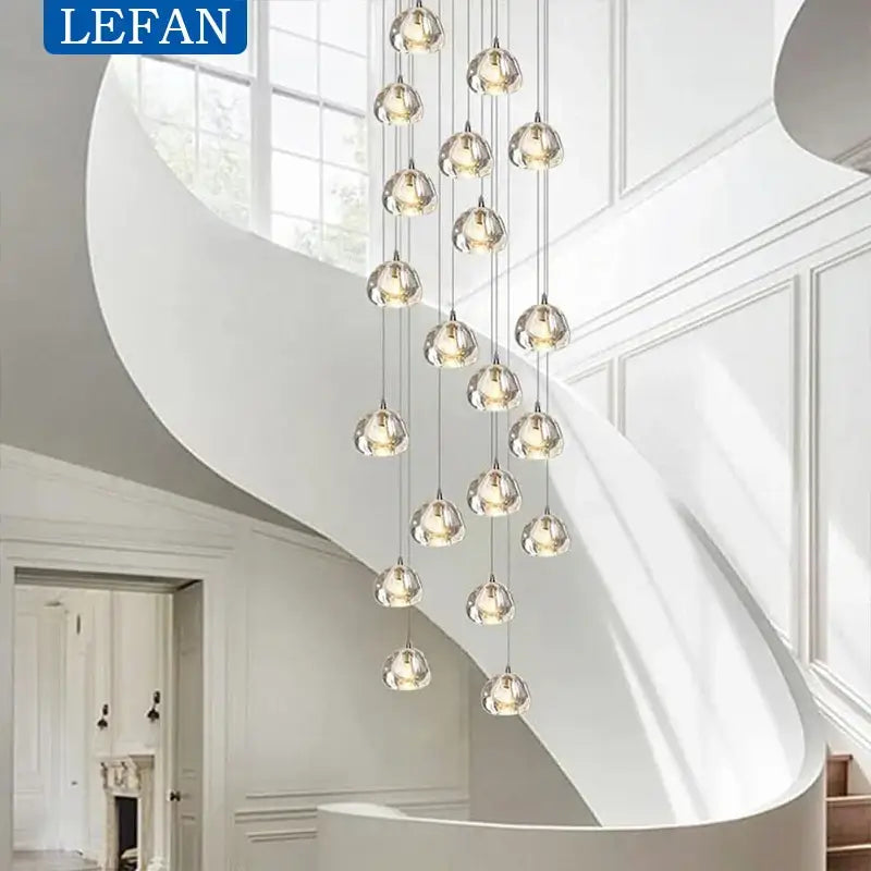 Modern silver crystal pendant light featuring clear glass globes with cord pendant installation for dining room use