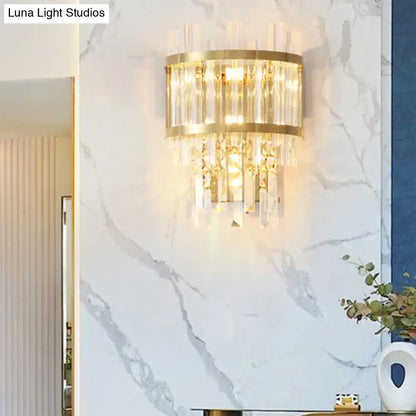 Modern gold-toned wall light with vertical crystal rods and faceted crystals wall mounted fixture width ideal for dining room