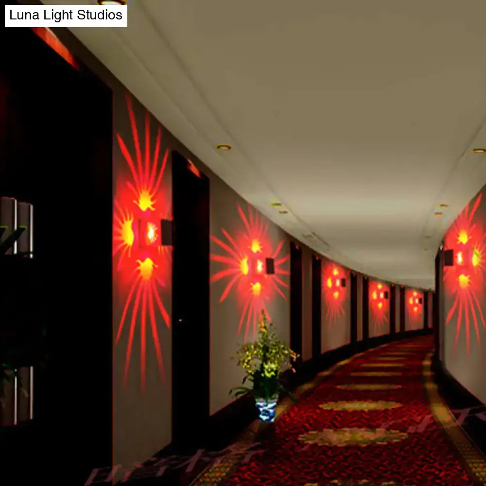 Modern silver cube led wall sconces with bulb included casting red starburst light projections along hotel corridor