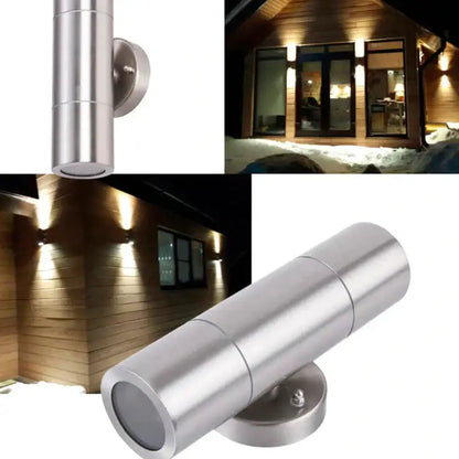 Modern silver cylindrical outdoor wall sconce with a sleek design and brushed metal finish for minimalist lighting