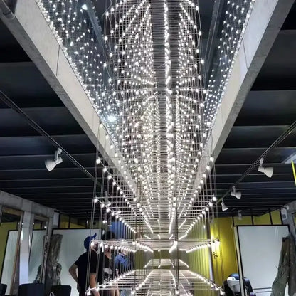 A dazzling white led decorbites cosmos chandelier with a grid of bulbs creating a starry effect for dining rooms