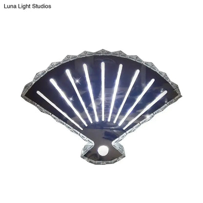 Modern silver fan wall lamp with scalloped edge and glowing led light strips for bedroom black fan wall decor