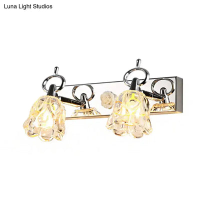 Modern silver finish wall light with clear glass flower-shaped shades for bathroom vanity illumination