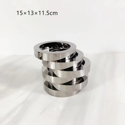 Stack of five interlocking silver metallic rings with geometric circle design for decorbites crystal glass geometric vase decor