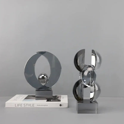 Modern silver geometric crystal sculpture with interlocking circular elements for home decor by decorbites geometric crystal