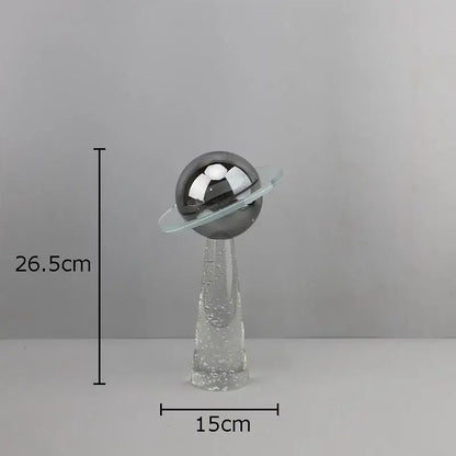 Modern silver geometric crystal star desk sculpture with a reflective metallic sphere and glass bubble base decorbites geometric crystal