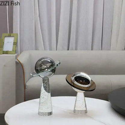 Two sleek modern glass desk sculpture ornaments with geometric crystal star design silver accents and bubble details