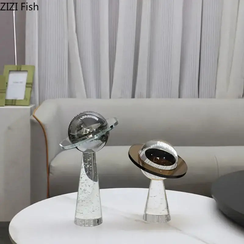 Two sleek modern glass desk sculpture ornaments with geometric crystal star design silver accents and bubble details