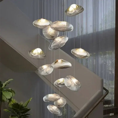 Modern silver glass led chandelier with shell pendant design and warm internal lighting for dining room use