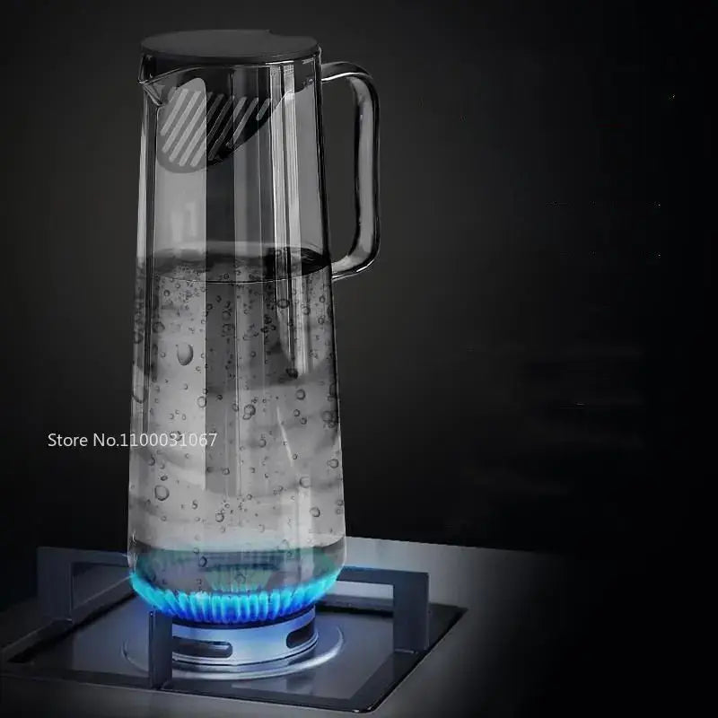Modern silver glass water pitcher with a clear glass body black lid handle and internal strainer for glass water use