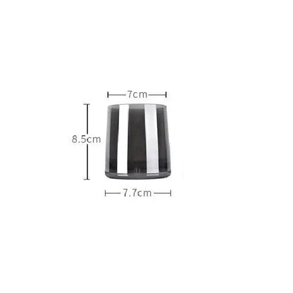 A sleek cylindrical glass water pitcher with bold vertical black and silver stripes and a lid for kitchen use