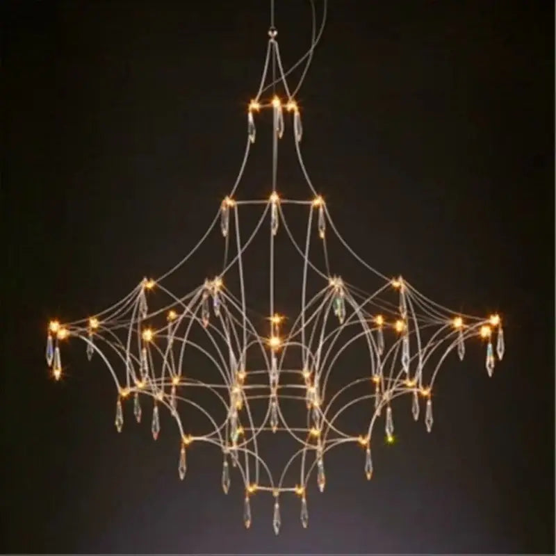 Modern silver pendant light with delicate metal frame and crystal pendants as a focal point in modern design dining room