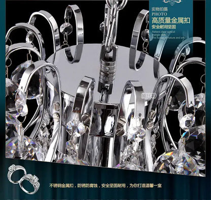 Modern silver and gold decorbites crystal chandelier with chrome finish metal arms and clear crystal droplets for living room