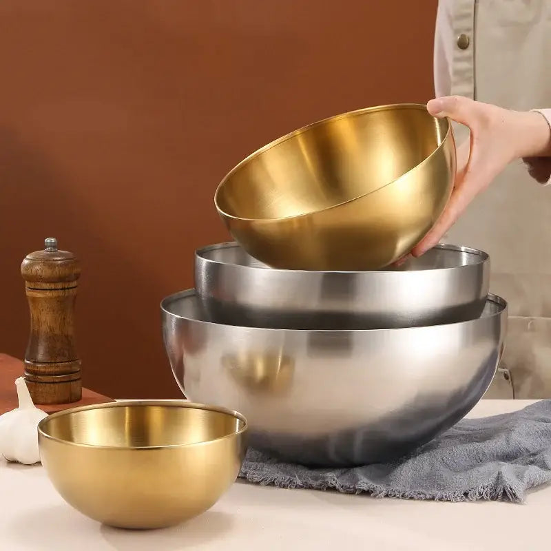 Set of nested modern silver and gold stainless steel mixing bowls with a brushed metallic finish by decorbites stainless steel