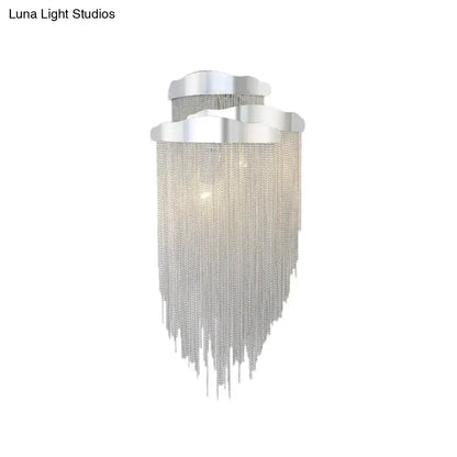 Modern silver tassel design wall lamp with cascading chain fringe and bulb base for bedroom lighting