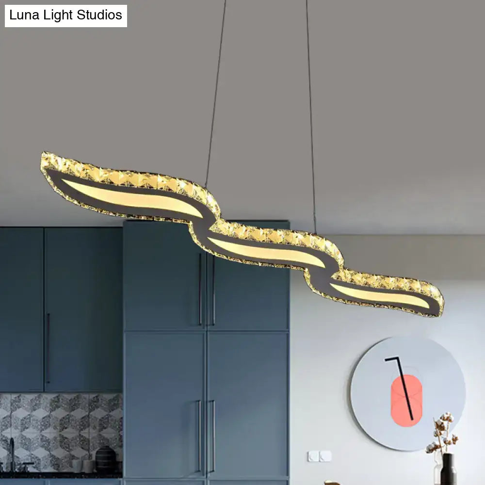 Gold-finished sculptural pendant ceiling light with textured waves and warm led illumination for silver island decor