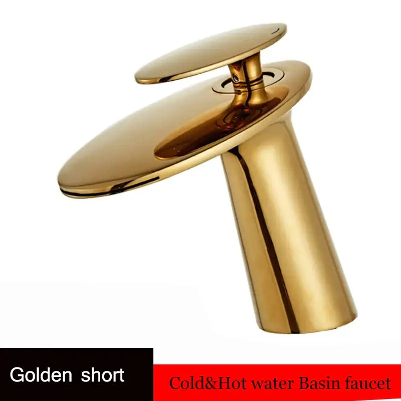 Golden short waterfall basin faucet with sleek modern design and polished brass finish for bathroom decor