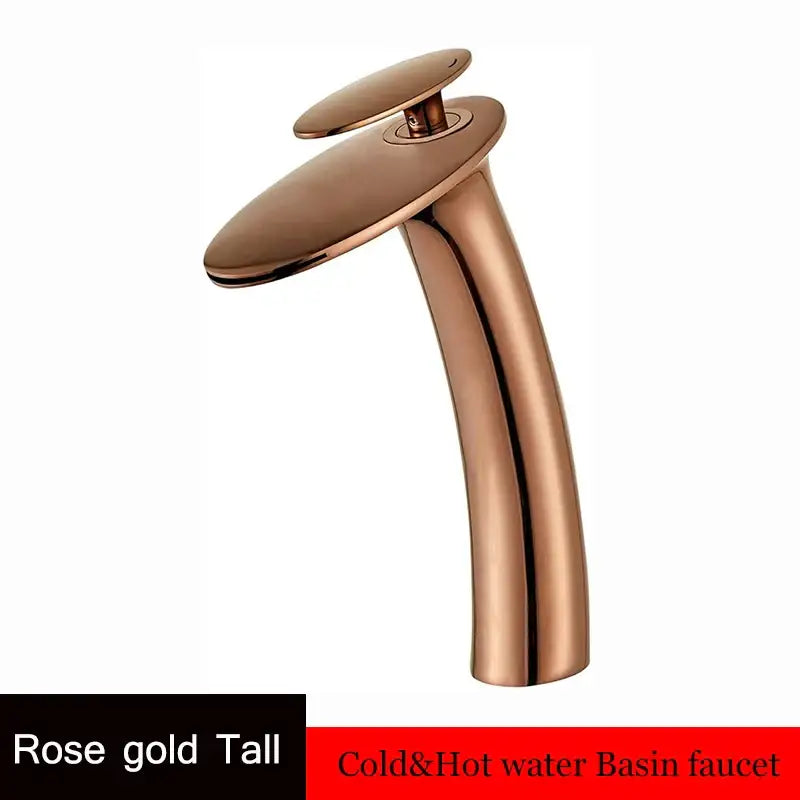 Rose gold waterfall basin faucet with a sleek modern design and smooth curved spout for bathroom decor