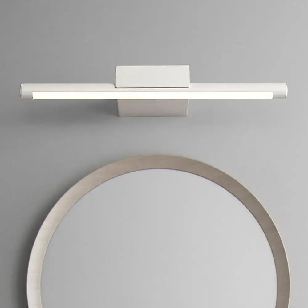 Modern slim white warm light fixture with sleek rectangular design and minimalist mounting bracket for bathroom use