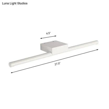 White rectangular wall-mounted light fixture with modern slim design and warm light for bathroom use 27.5 by 4.5 inches