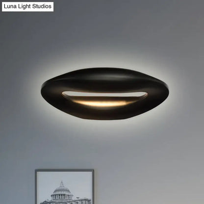 Modern black white smiling face led wall lamp with oval ceiling light design and warm ambient glow for corridors