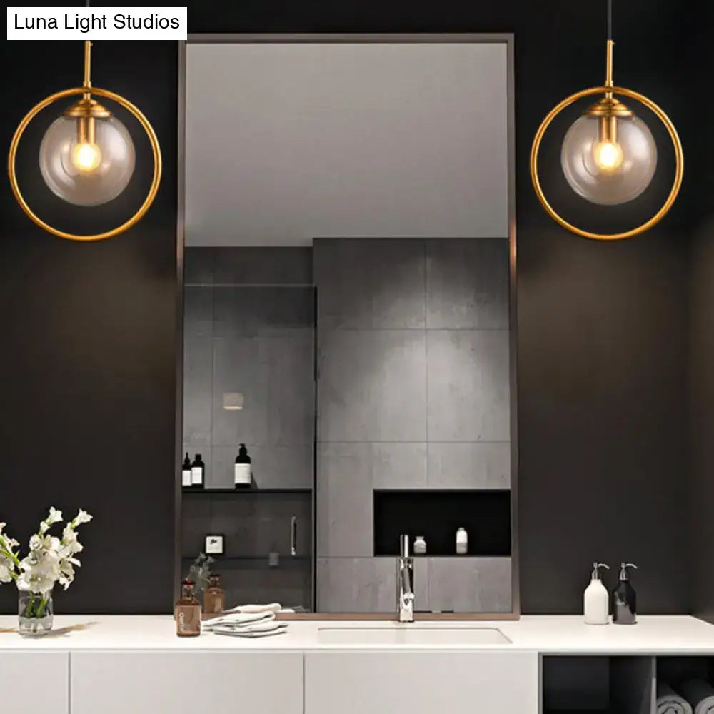 Gold-toned modern smoke gray clear glass globe pendant lights with circular metal frames for bathroom vanity 220v-240v 110v-120v