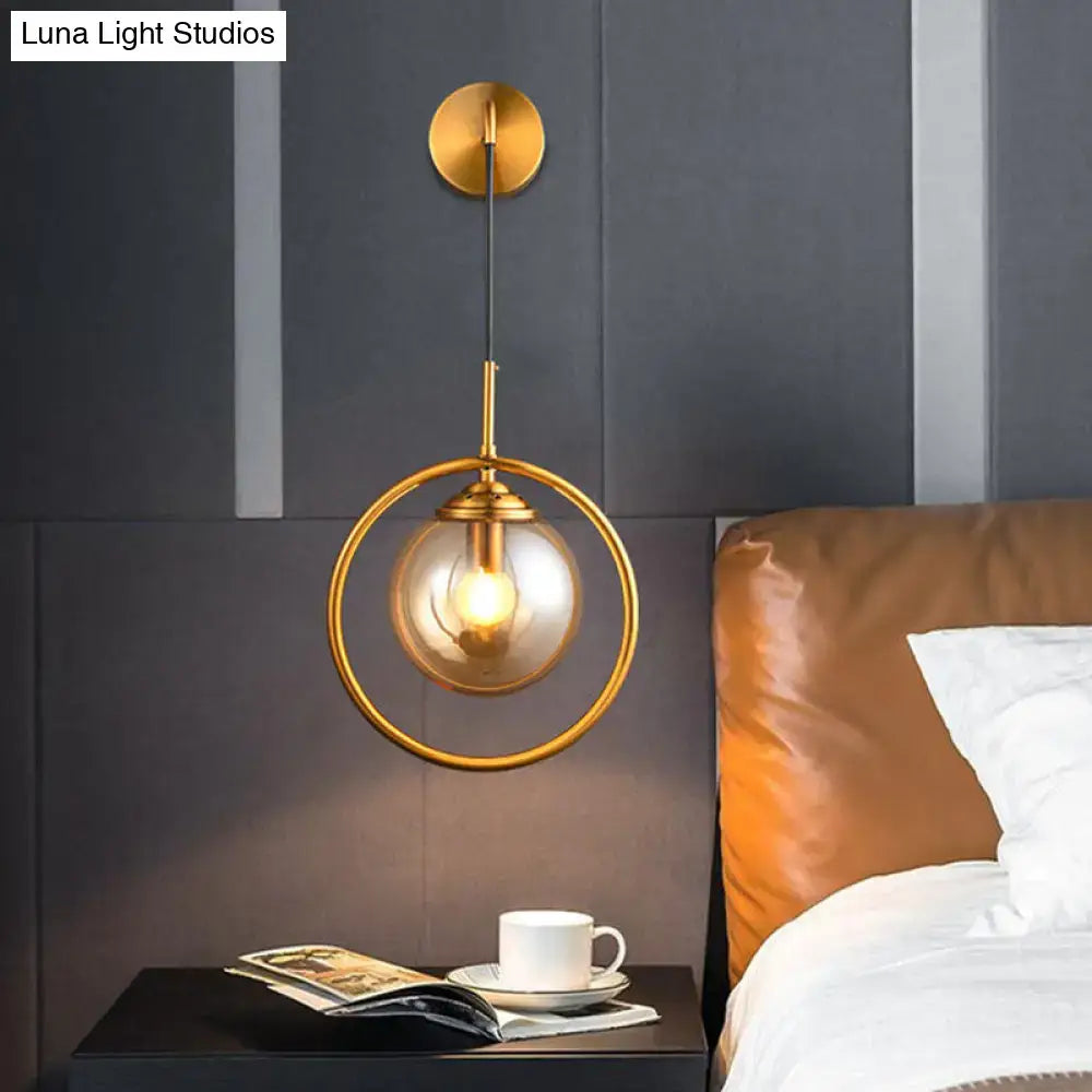 Gold-toned modern smoke gray clear glass globe sconce with circular frame for bedroom wall light 220v-240v 110v-120v