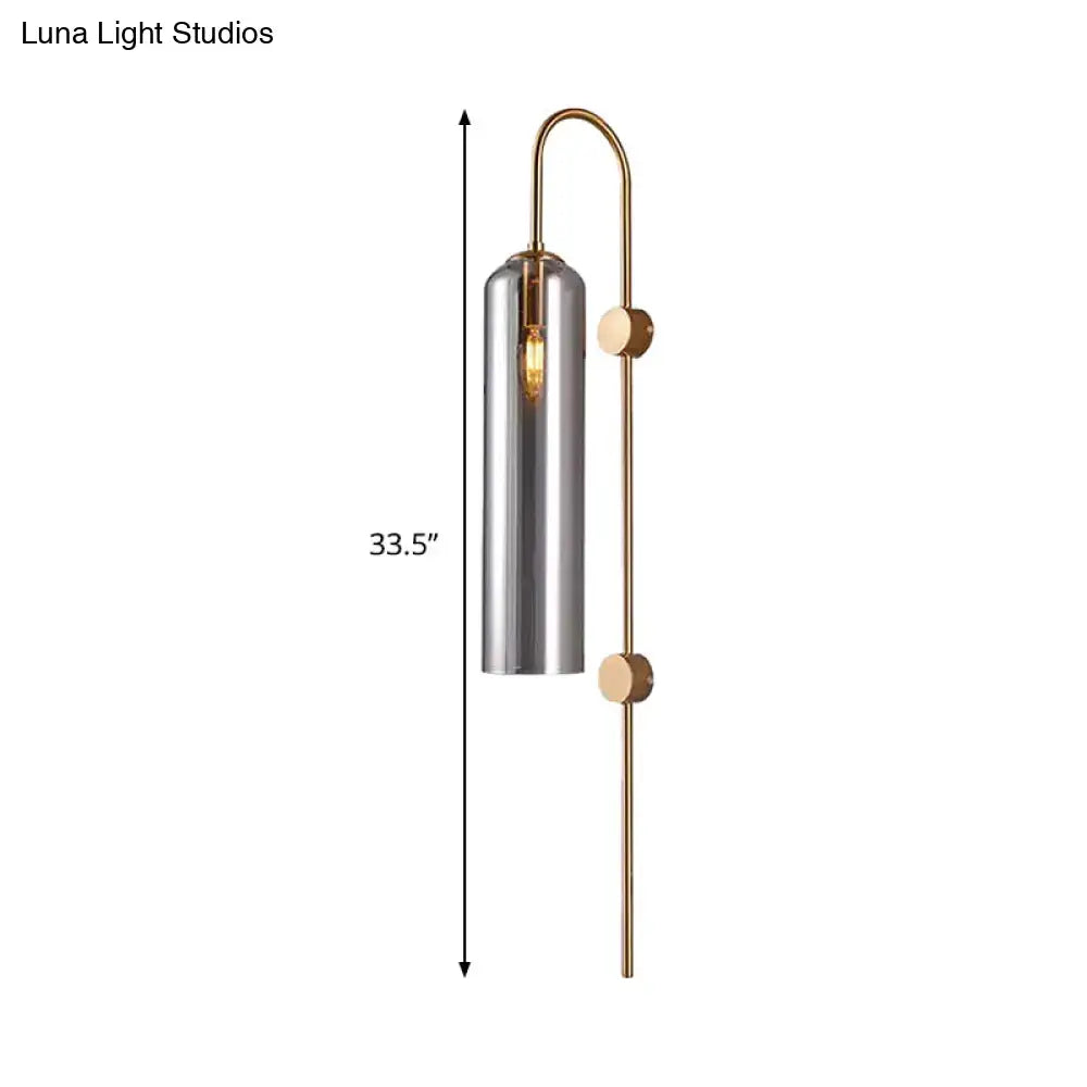 A sleek 33.5-inch modern smoke gray glass wall light with brushed metal shade and wooden accents for living room