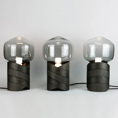Three modern table lamps with dark textured resin n823 bases and translucent gray smoked glass domes for bedroom decorbites creative resin lighting