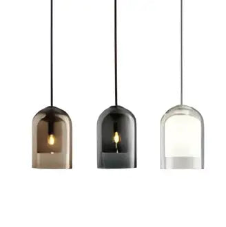 Three minimalist glass led chandelier pendant lights with warm amber and cool white glow for dining room